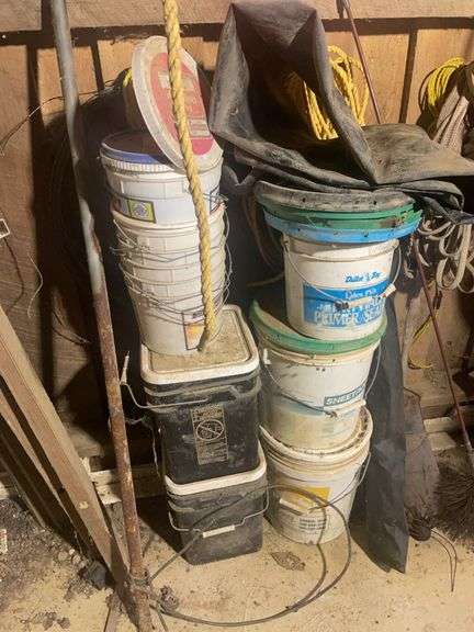 Contents of corner including buckets, roping, scrap wood and more