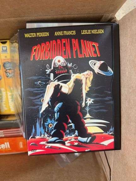 Box of VCR Tapes and DVDs