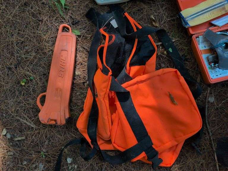 Stihl MS 201C chainsaw, protective helmet, and extra chains