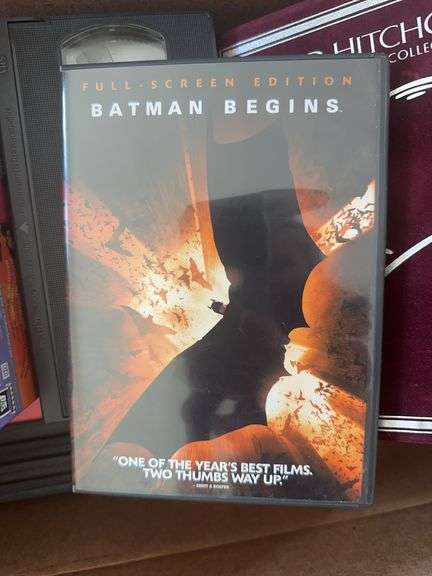 Box of VCR Tapes and DVDs