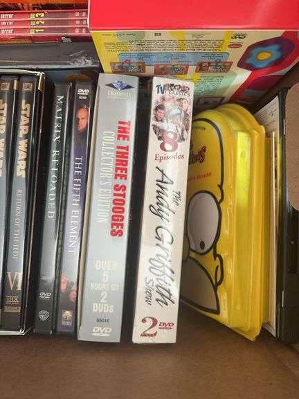 Box of VCR Tapes and DVDs