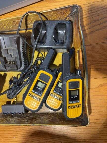 Totes with DeWalt walkie talkies, battery chargers, gloves, tape gun, and other items