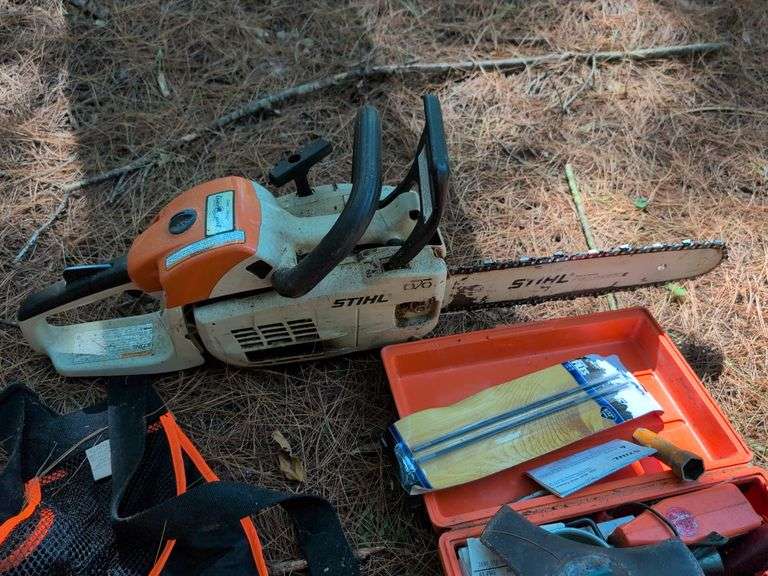 Stihl MS 201C chainsaw, protective helmet, and extra chains