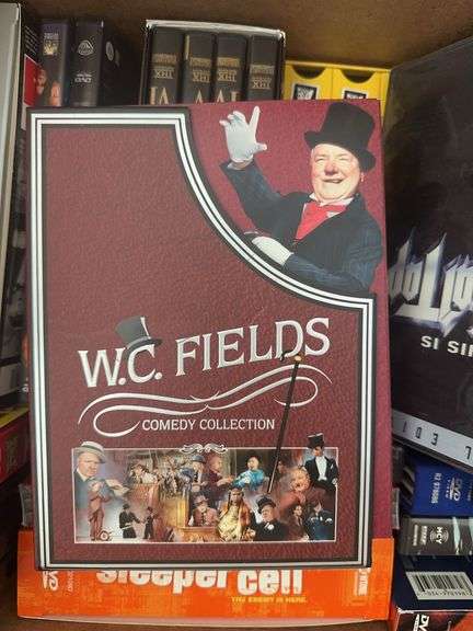 Box of VCR Tapes and DVDs