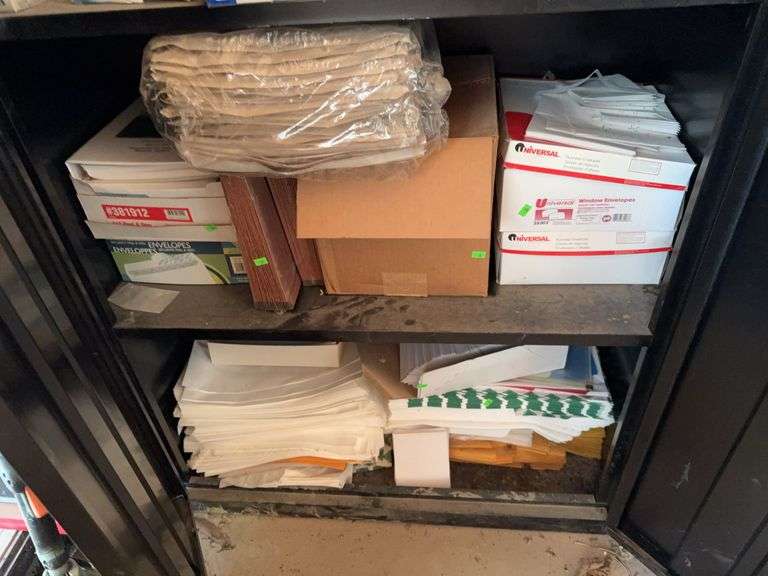 Contents of Bottom Two Shelves envelopes and paper