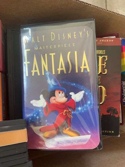 Box of VCR Tapes and DVDs