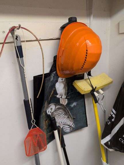 Contents of corner - dehumidifier, hard hat, cleaning items, and more