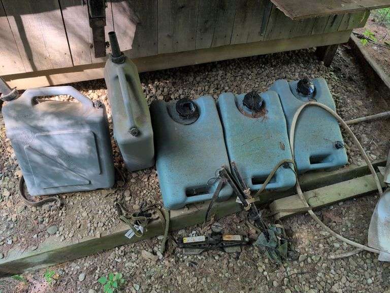 (3) portable waste water tanks, (2) water tanks, and 1.8 ton car jack