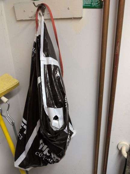 Contents of corner - dehumidifier, hard hat, cleaning items, and more