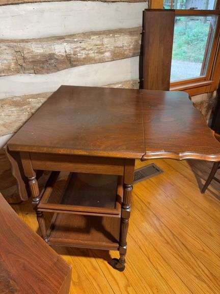 Wooden drop leaf stand with wheels and log bench