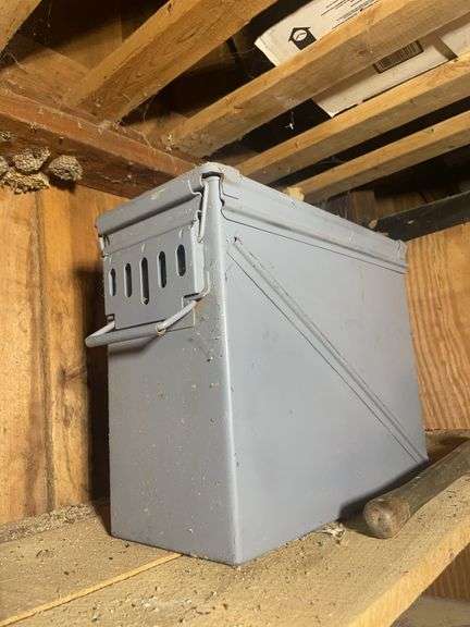 Assortment of ammo boxes and military shovels