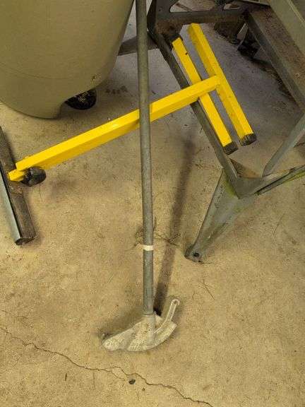Trash barrel with piping, work stand, conduit bender, and roller