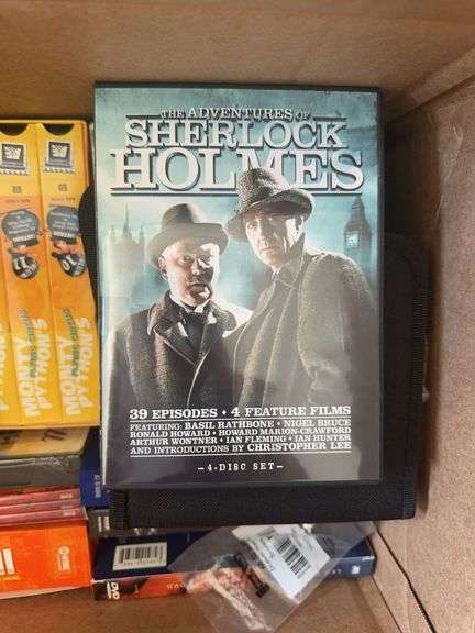 Box of VCR Tapes and DVDs
