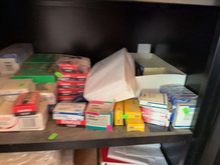 Contents of Shelf; paper clips, tape and sticky notes
