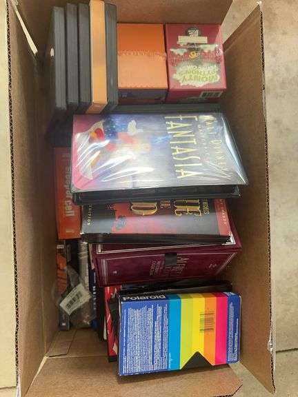 Box of VCR Tapes and DVDs
