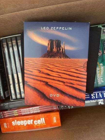 Box of VCR Tapes and DVDs