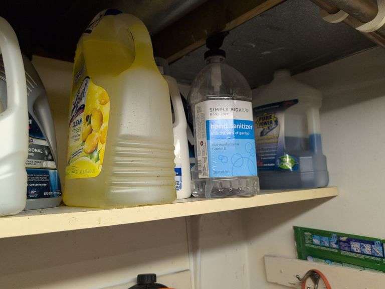 Contents of corner - dehumidifier, hard hat, cleaning items, and more