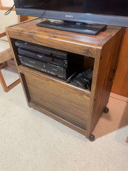 Wooden rolling stand with 40" Sony TV and DVD player and recorder