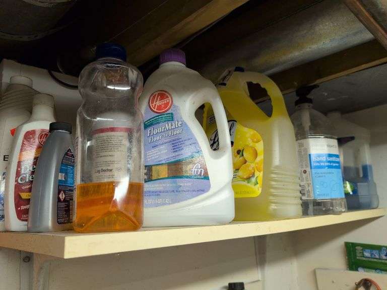 Contents of corner - dehumidifier, hard hat, cleaning items, and more