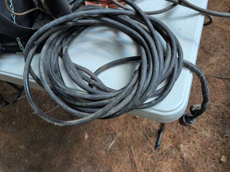 (2) tool belts with tools, extension cords, and other items