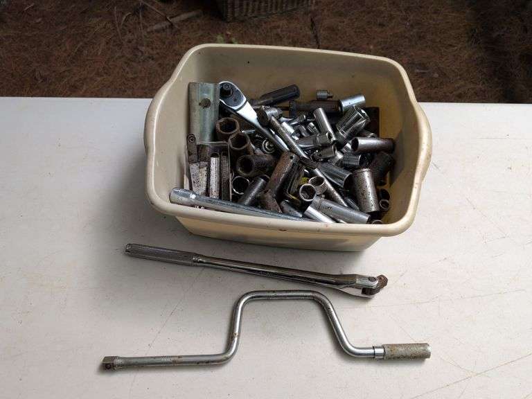 Bin of sockets, socket wrenches, extenders, and more