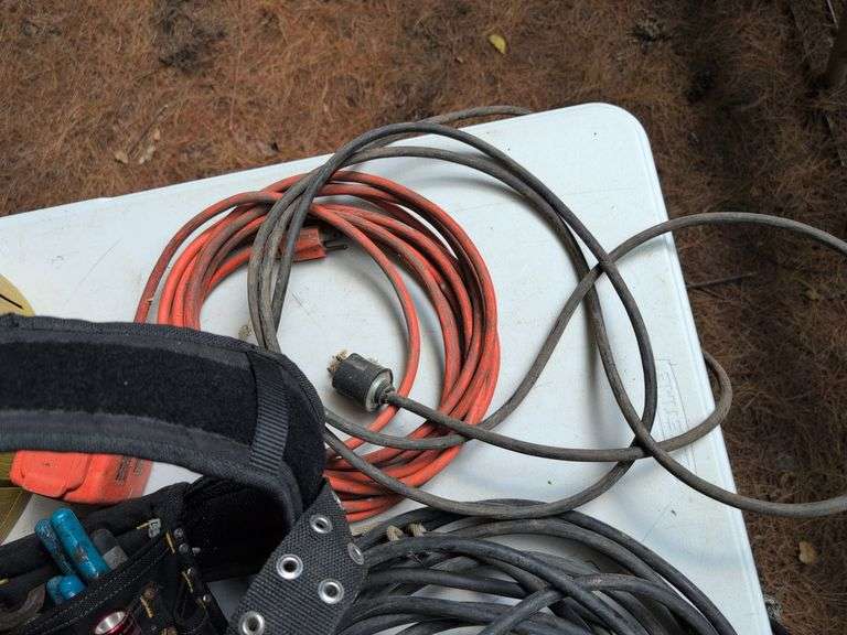 (2) tool belts with tools, extension cords, and other items