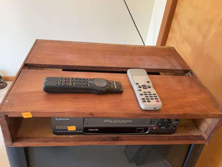 Panasonic 27” Colored Television, Emerson Video Cassette Player, Mounting Box