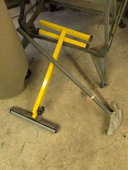 Trash barrel with piping, work stand, conduit bender, and roller