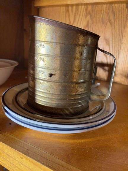 (2) shelves of stainless steel mixing bowls, cake pans, cupcake pan, loaf pans, and more