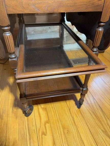 Wooden drop leaf stand with wheels and log bench