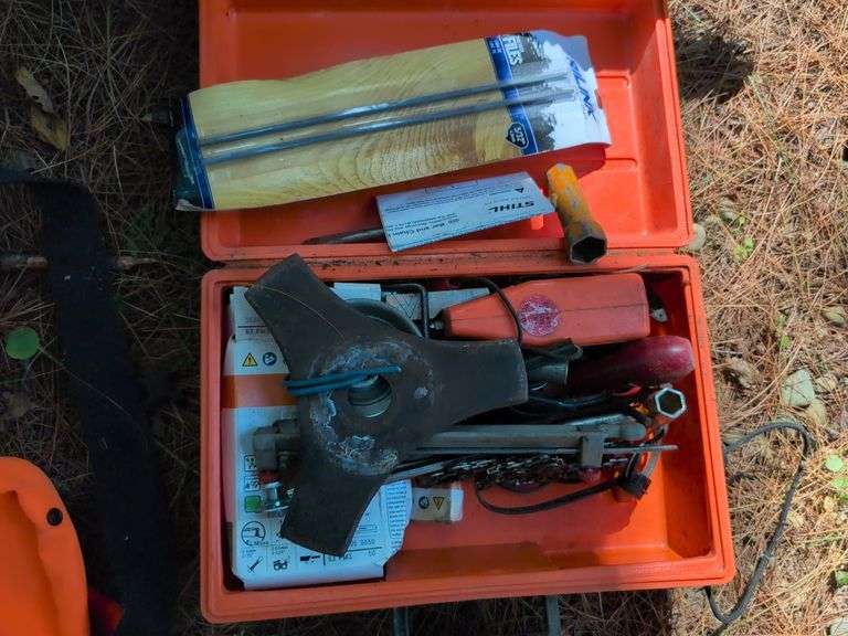 Stihl MS 201C chainsaw, protective helmet, and extra chains