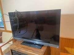 Wooden rolling stand with 40" Sony TV and DVD player and recorder