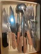 Cooking utensils, dumbbells, and other items