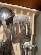 Cooking utensils, dumbbells, and other items