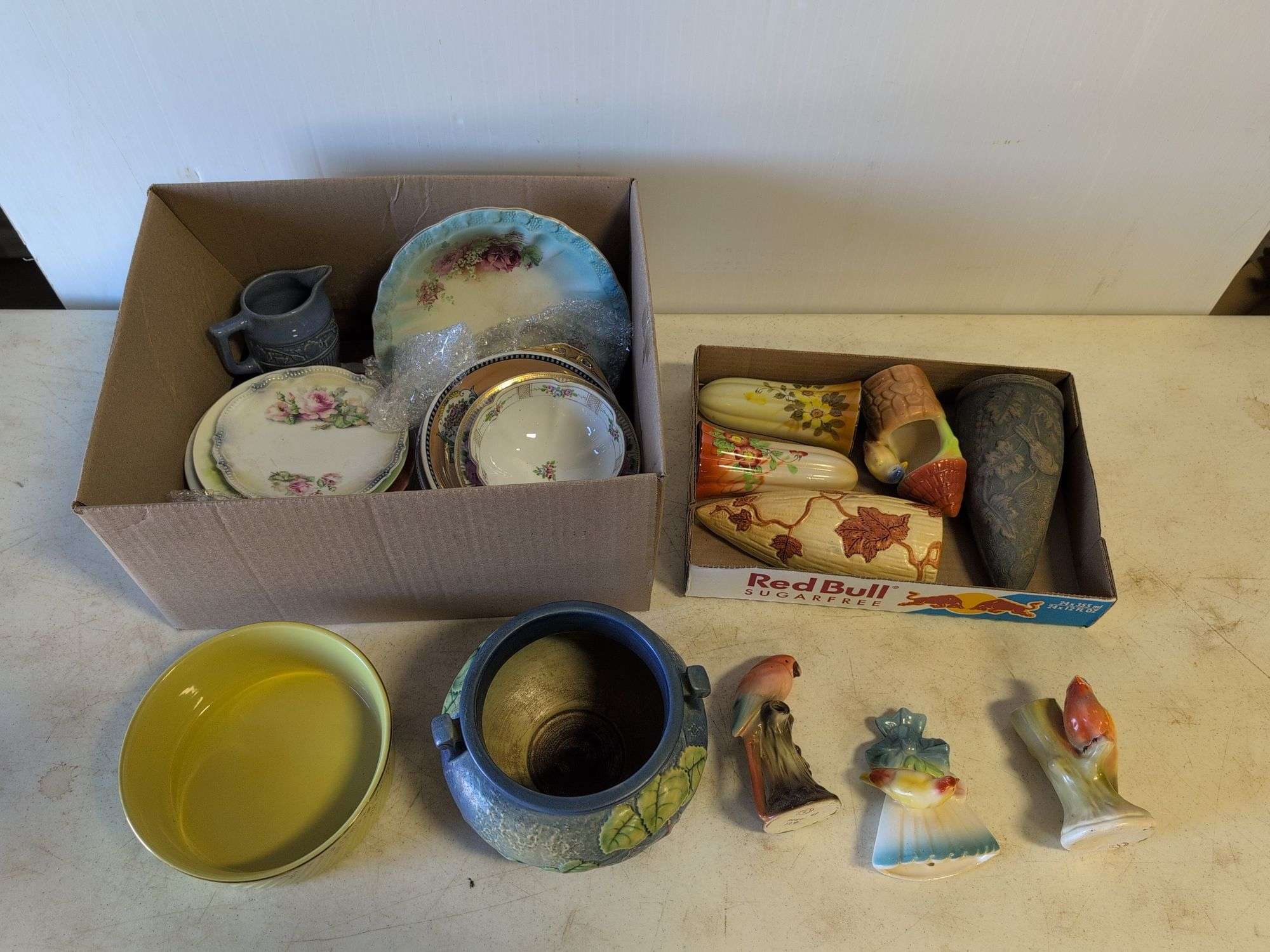 Roseville pottery piece with crack, other pottery, and decor