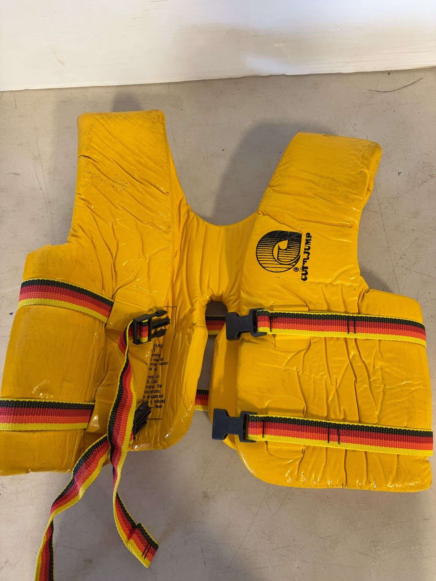 Bucket dolly, (2) life jackets, and string