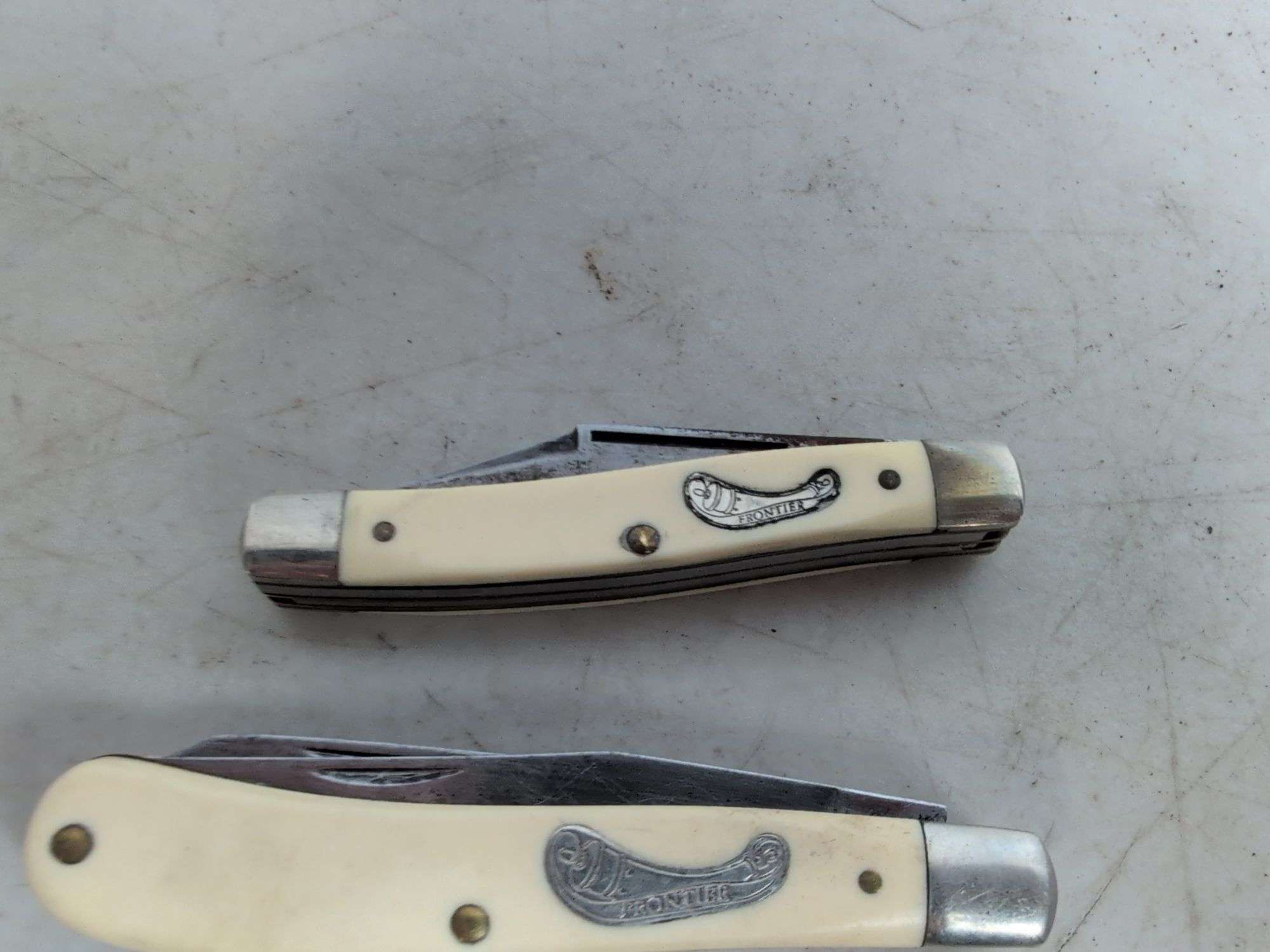 (2) Frontier pocket knives