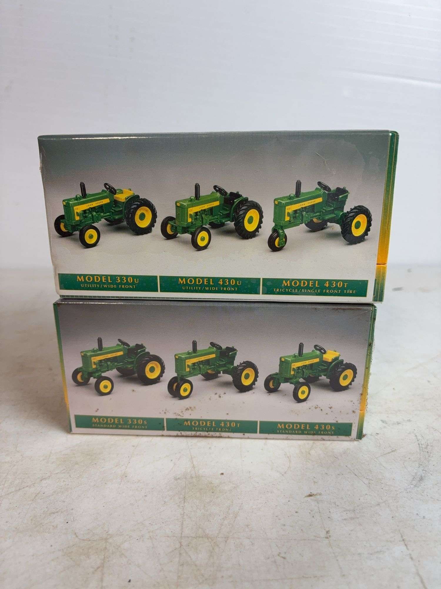 (2) John Deere historical tractor toy sets - 1/64 scale, factory sealed