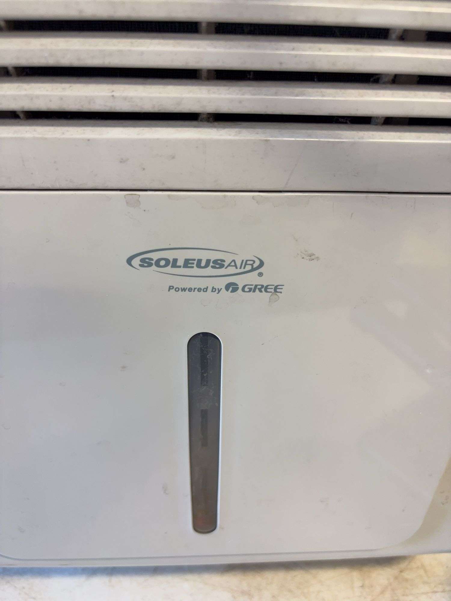 Soleus Air dehumidifier and camo foldable chair