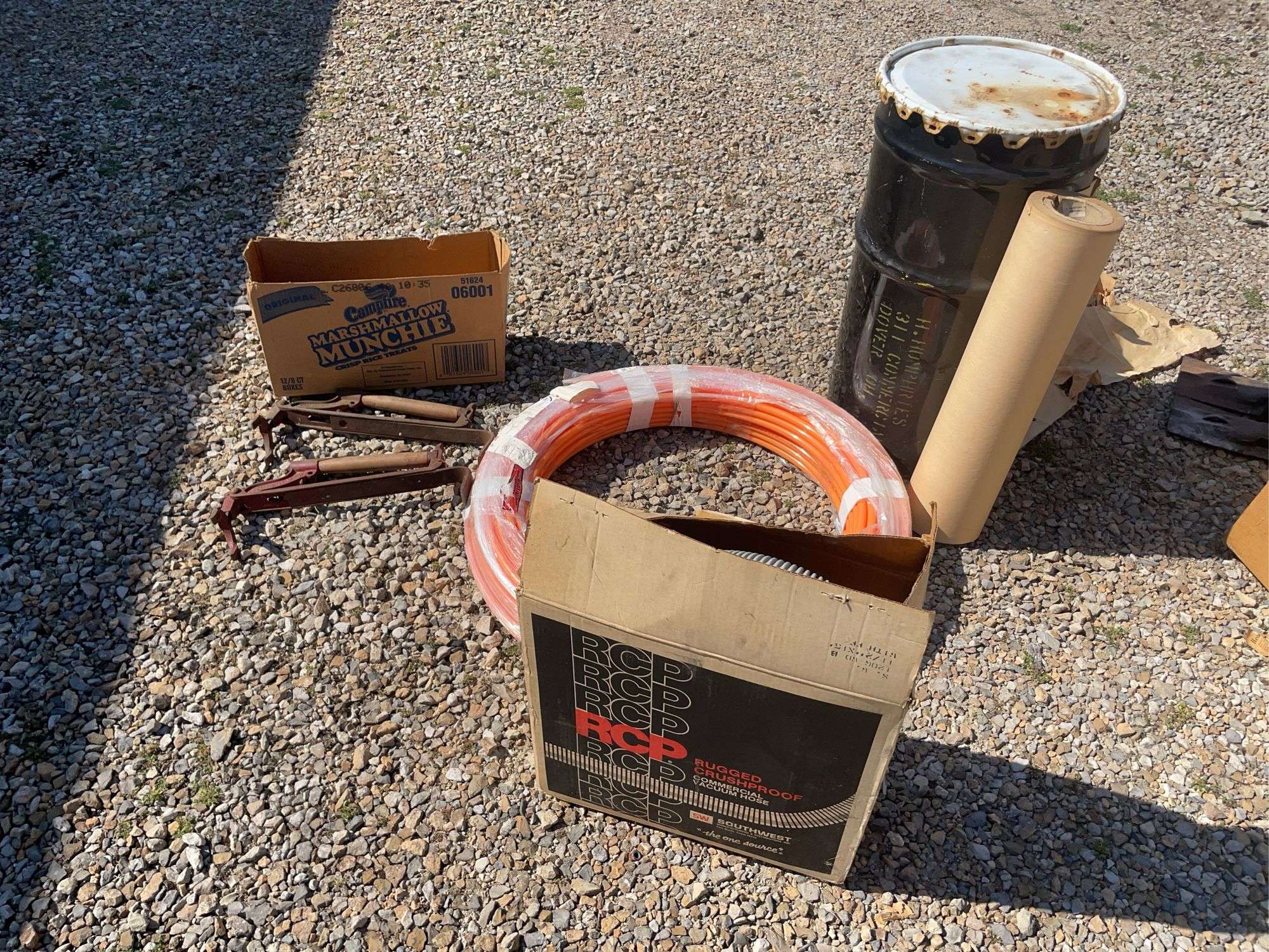 Metal drum, Pex tubing, vacuum hose and Fuller Brikarier brick carrier