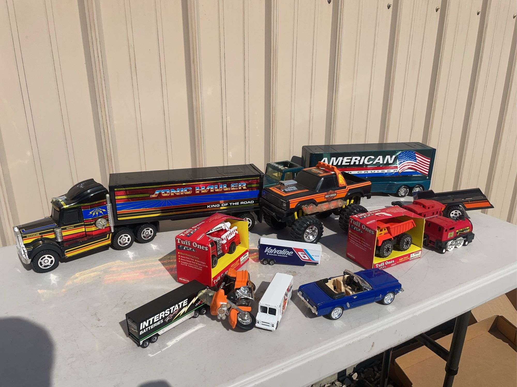 Box of toy cars/ trucks