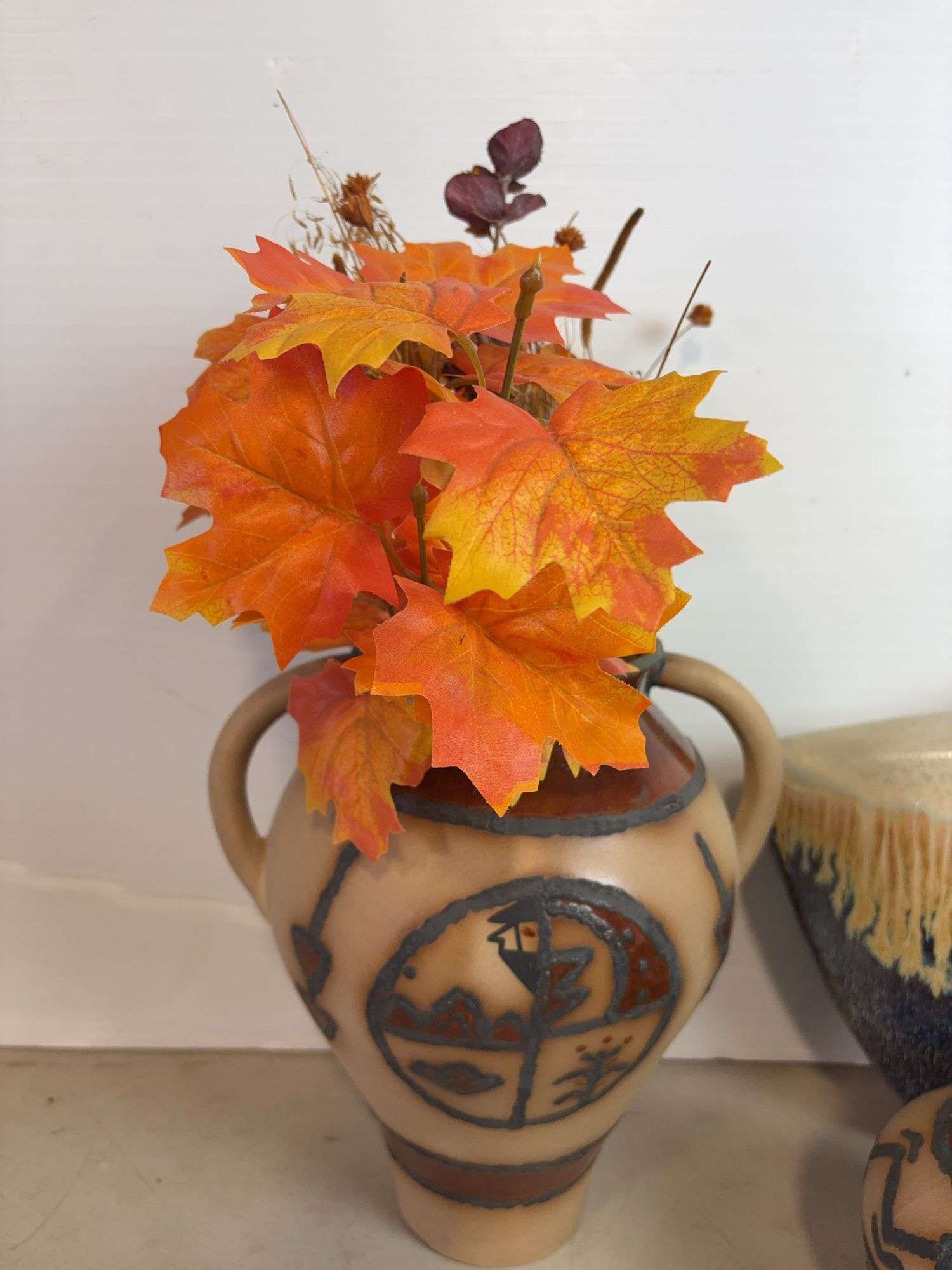 Vases with silk flowers, cups, and more