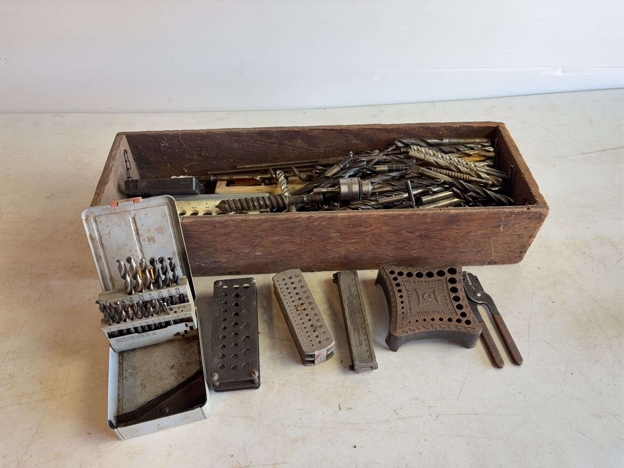 Wooden crate of miscellaneous drill bits