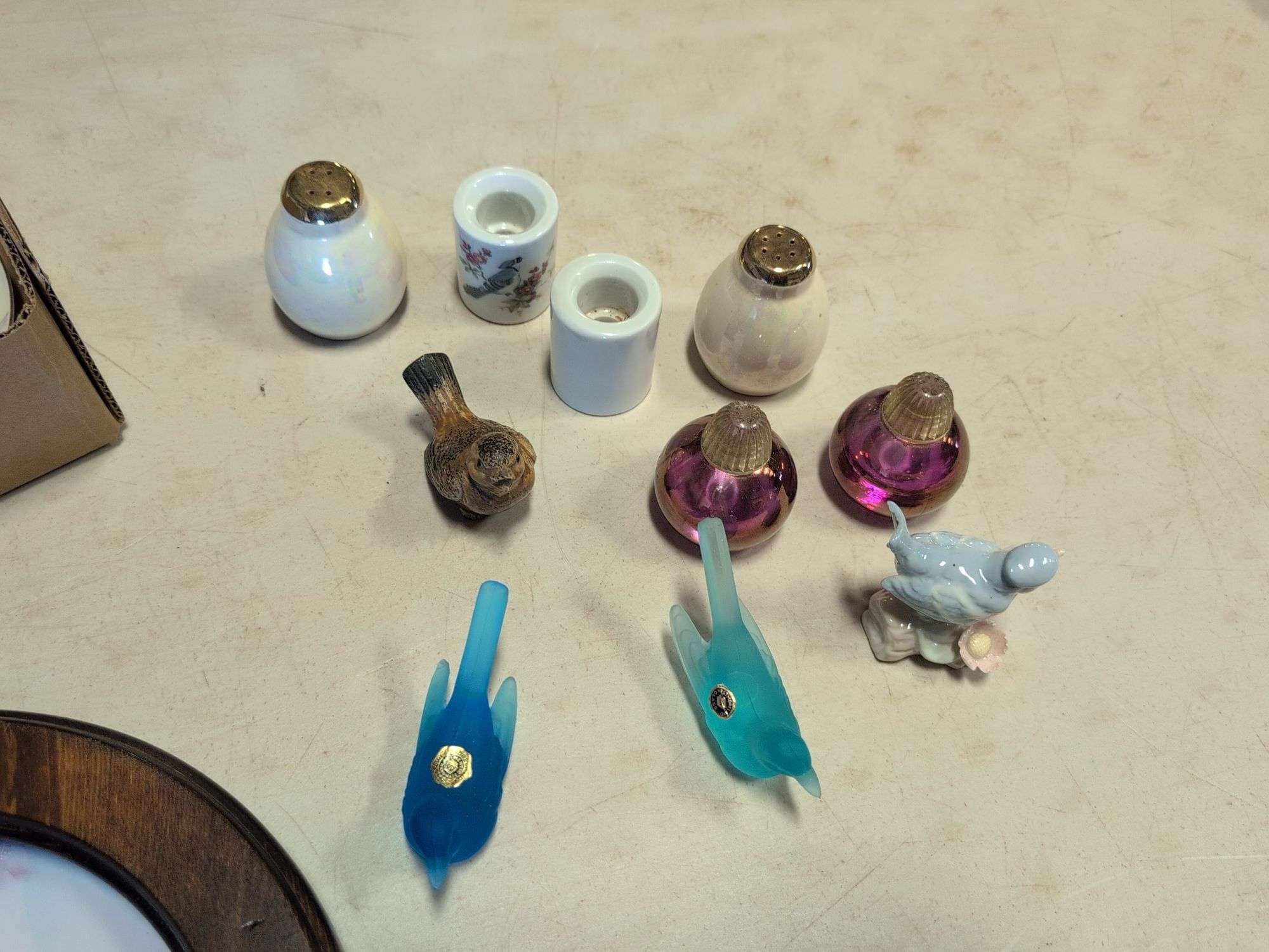 Assortment of decorative plates and glass decor