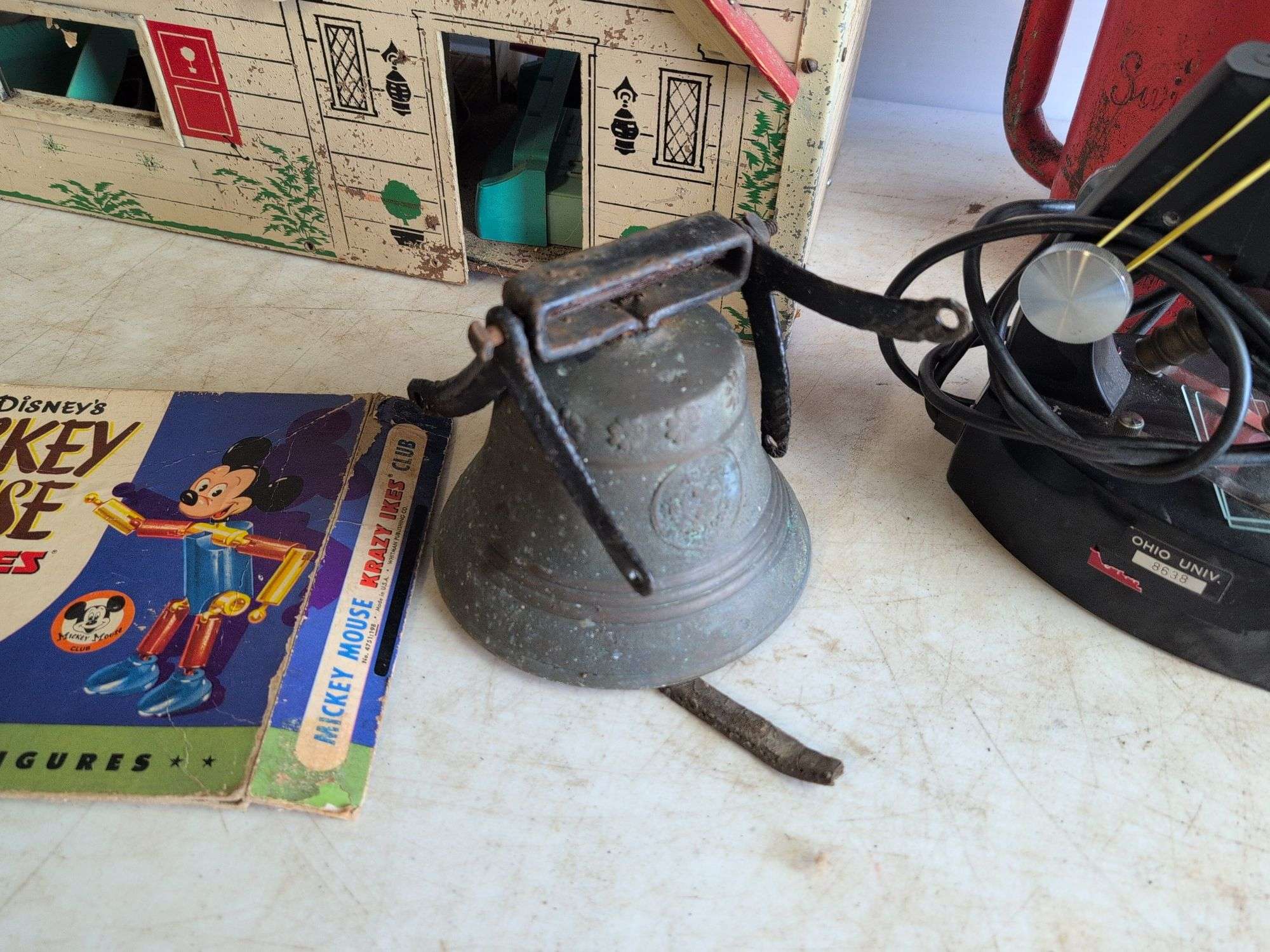 Small metal bell, watering can, and more