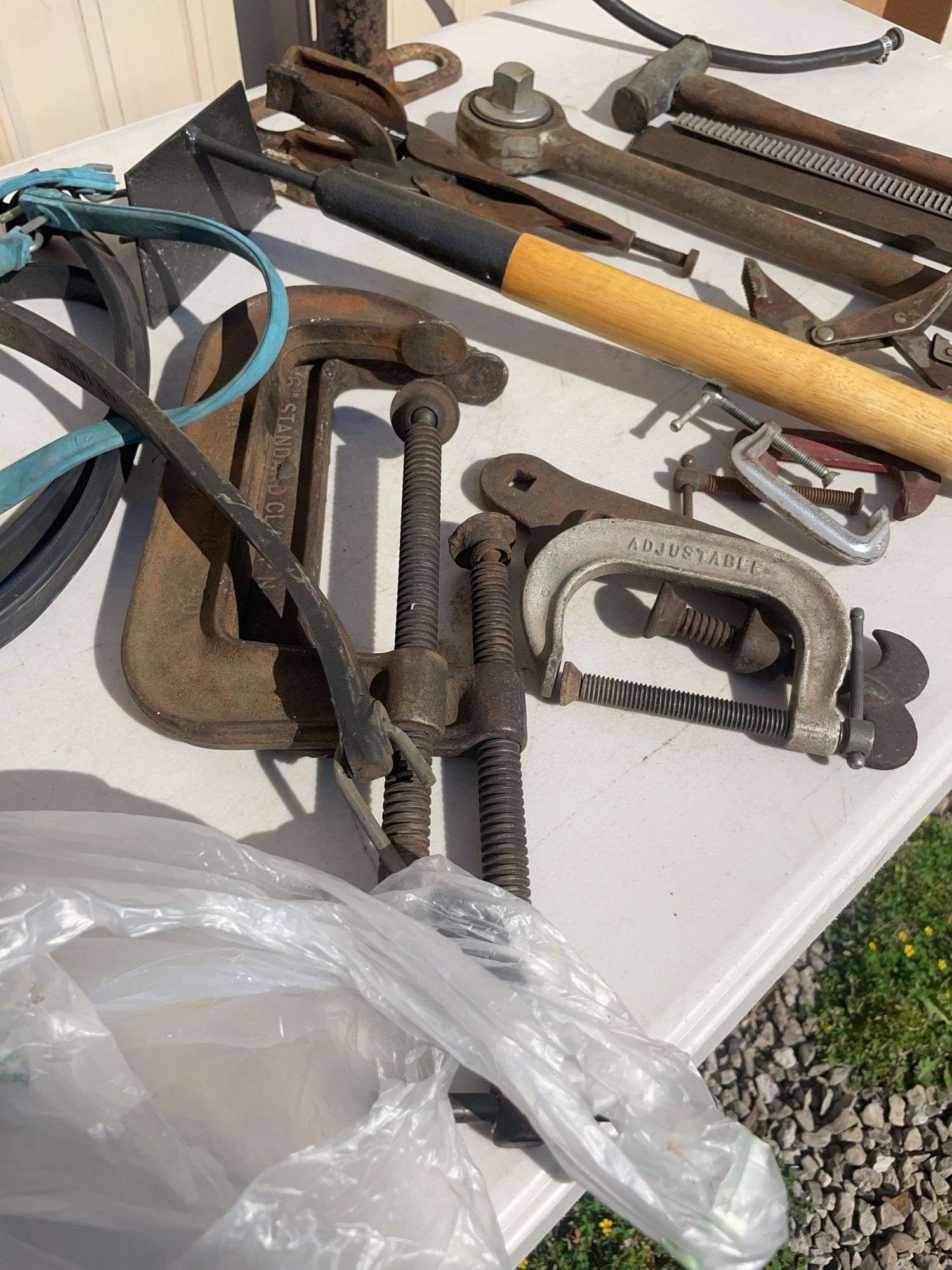 Lot of tools including pump, clamps, file and more