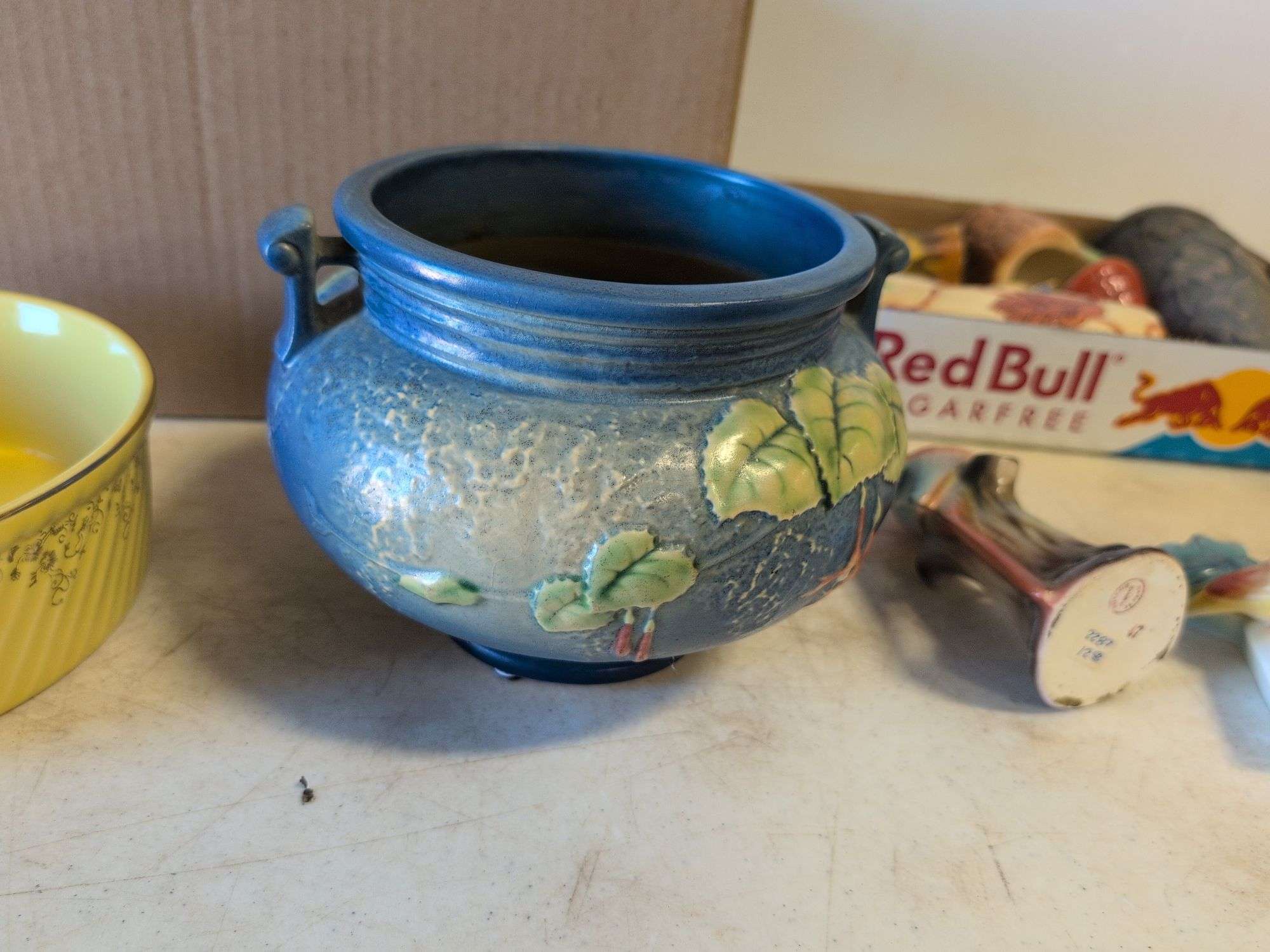 Roseville pottery piece with crack, other pottery, and decor