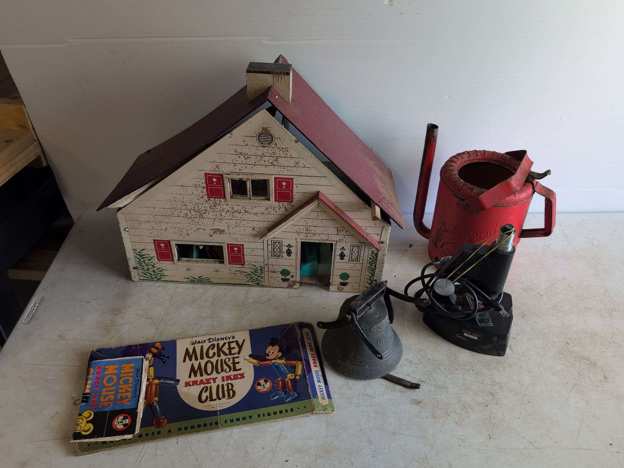 Small metal bell, watering can, and more