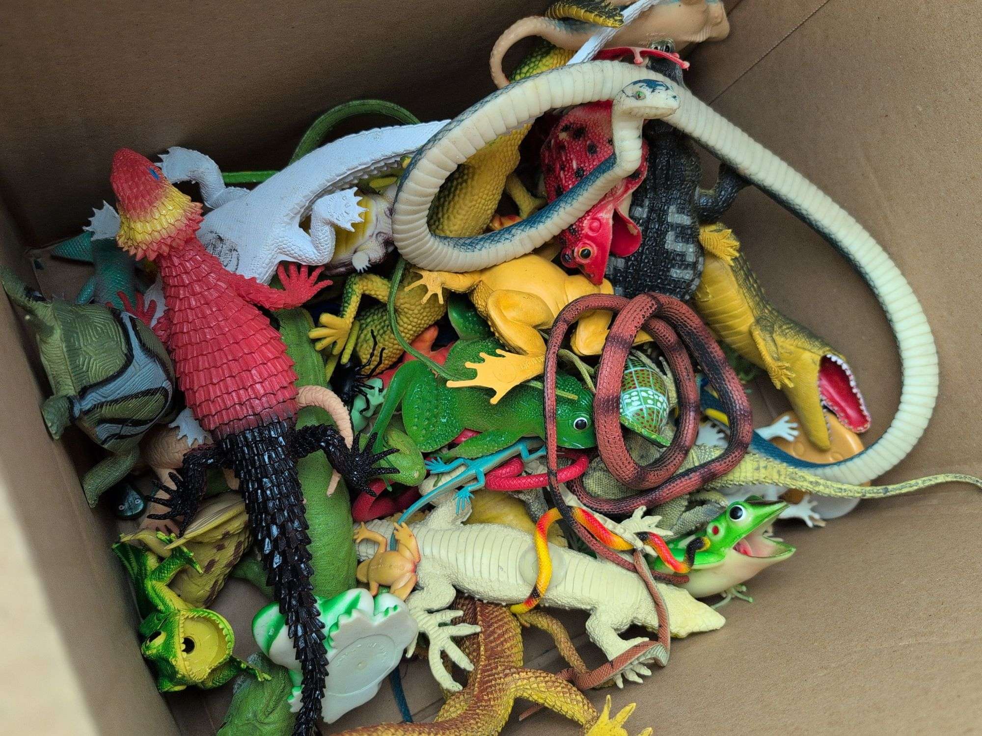 (4) boxes of toy animals