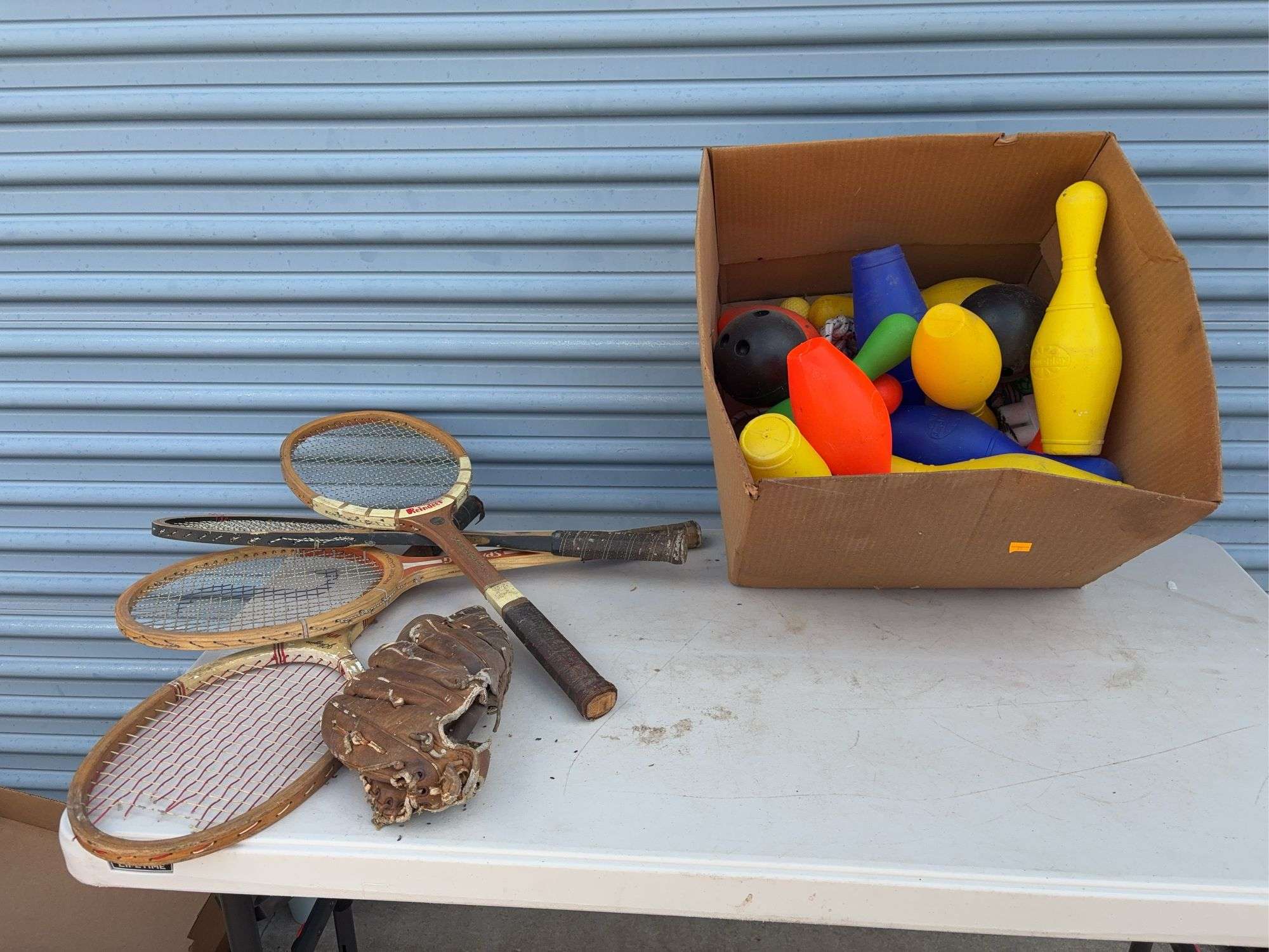 (4) racquets, baseball glove, toy bowling pin and game set
